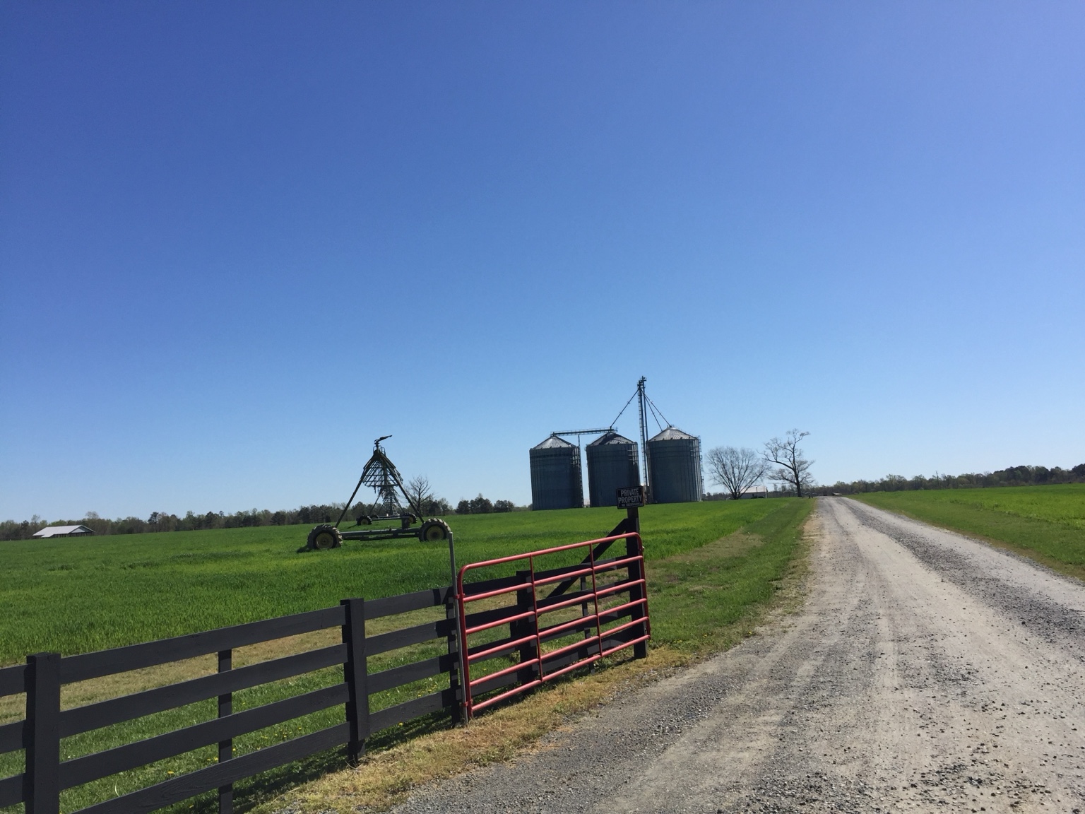 Farm entrance, grain bins, and irrigation equipment