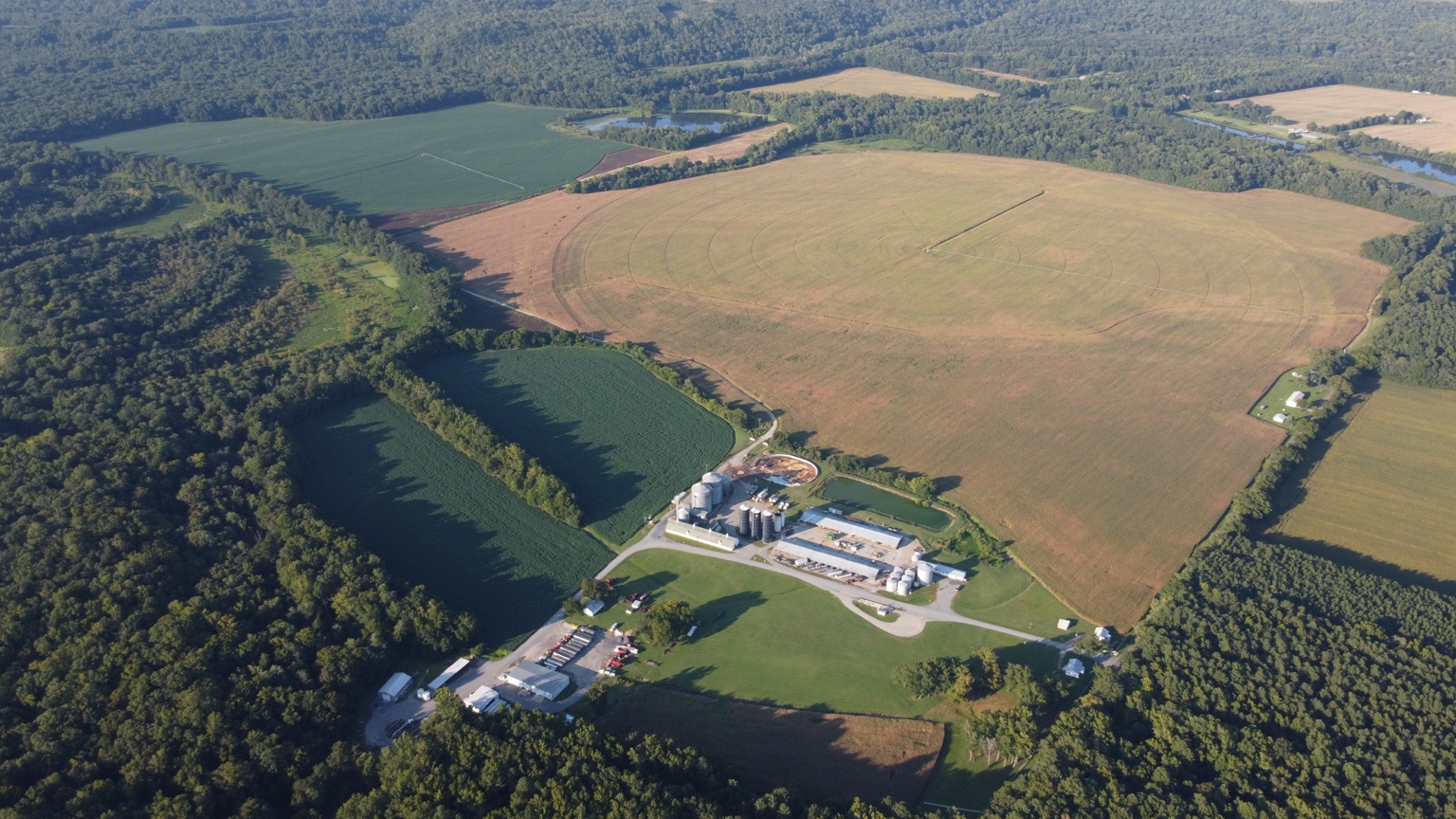 High aerial view of the home farm and surrounding managed acreage